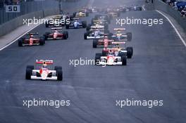 Ayrton Senna da Silva (BRA) McLaren MP4/5B Honda 3rd position leads the group at start
