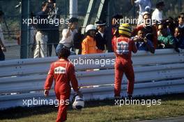 ALain Prost (FRA) Ferrari and Ayrton Senna da Silva (BRA) McLaren walk back to the pits after the crash at start