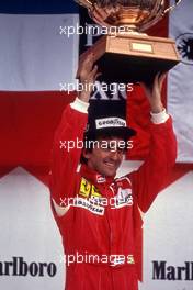 Alain Prost (FRA) Ferrari 641 1st position celebrates podium