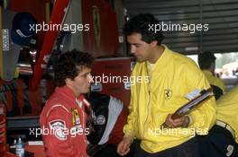 Alain Prost (FRA) Ferrari 1st position talks with Luigi Mazzola