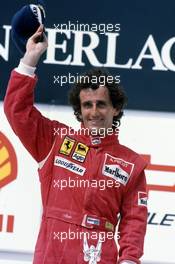 Alain Prost (FRA) Ferrari 1st position celebrates podium