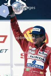 Ayrton Senna da Silva (BRA) McLaren MP4/5B Honda 3rd position celebrates on podium