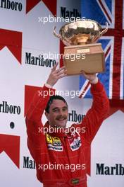 Nigel Mansell (GBR) Ferrari 2nd position celebrates podium