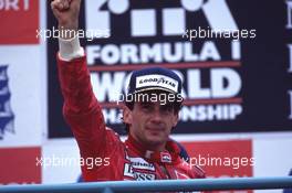 Ayrton Senna da Silva (BRA) McLaren MP4/5B 1st position celebrates on podium