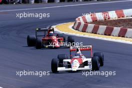 Gerhard Berger (AUT) McLaren MP4/5B Honda 2nd position leads Alain Prost (FRA) Ferrari 641 1st position