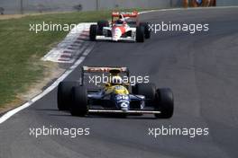Riccardo Patrese (ITA) Williams FW13B Renault 1st position leads Gerhard Berger (AUT) McLaren MP4/5B Honda 2nd position