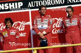 Alain Prost (FRA) Ferrari 2nd position Ayrton Senna da Silva (BRA) McLaren 1st position Gerhard Berger (AUT) McLaren 3rd position celebrates podium