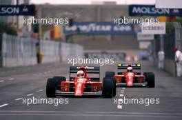 Nigel Mansell (GBR) Ferrari 641 leads teammate Alain Prost (FRA)