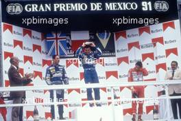 Nigel Mansell (GBR) Williams 2nd position Riccardo Patrese (ITA) Williams 1st position Ayrton Senna da Silva (BRA) McLaren 3rd position celebrate podium