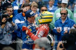 Nigel Mansell (GBR) Williams 2nd position and Ayrton Senna da Silva (BRA) McLaren 1st position celebrate podium