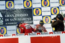 Ayrton Senna (BRA) McLaren Honda 1st position and Jyrki Jarvi Letho (FIN) Dallara Judd 3rd position celebrate podium with champagne