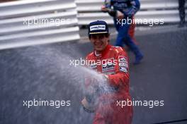 Ayrton Senna da Silva (BRA) McLaren celebrates 1st position with Champagne