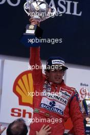 Ayrton Senna da Silva (BRA) McLaren Honda 1st position celebrates podium