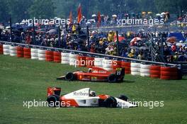 Gerhard Berger (AUT) McLaren MP4/6 Honda 2nd position and Alain Prost (FRA) Ferrari 642 on the grass during formation lap of grand prix