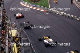 Ayrton Senna da Silva (BRA) McLaren MP4/6 Honda 1st position leads a group at Sainte Devote corner