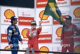 Riccardo Patrese (ITA) Williams 2nd position Ayrton Senna da Silva (BRA) McLaren 1st position Gerhard Berger (AUT) McLaren 3rd position celebrate podium