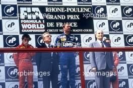 Alain Prost (FRA) Ferrari 2nd position Nigel Mansell (GBR) Williams 1st position Ayrton Senna (BRA) McLaren 3rd position celebrate podium with Jean Marie Balestre (FRA) President Fia and FFSA and Francois Mitterand (FRA) President of France