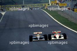 Ayrton Senna da Silva (BRA) McLaren MP4/6 Honda battles wheel to wheel with Nigel Mansell (GBR) Williams FW14 Renault 1st position