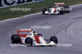 Ayrton Senna da Silva (BRA) McLaren MP4/7A Honda 3rd position leads teammate Gerhard Berger (AUT) at Tosa corner