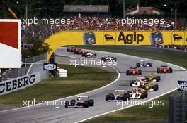Nigel Mansell (GBR) Williams FW14B Renault 1st position leads teammate Riccardo Patrese (ITA) 2nd position and the group at start