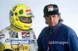 Christian Fittipaldi (BRA) Minardi talks with Emerson Fittipaldi (BRA)