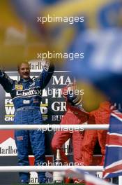 Nigel Mansell (GBR) Williams 2nd position celebrate podium
