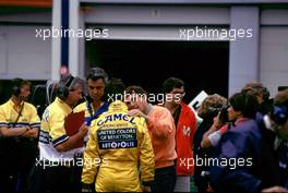 Ayrton Senna da Silva (BRA) McLaren Mp4/7A Honda talks with Michael Schumacher (GER) Benetton B 192 Ford after crash at Adelaide corner on first lap