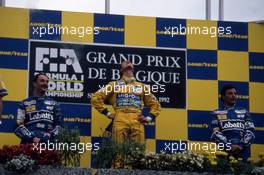 Nigel Mansell (GBR) Williams 2nd position Michael Schumacher (GER) Benetton 1st position Riccardo Patrese (ITA) Williams 3rd position celebrates podium