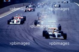 Riccardo Patrese (ITA) Williams FW14B Renault 2nd position leads the group at start