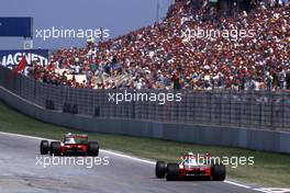 Ayrton Senna da Silva (BRA) McLaren MP4/7A Honda 3rd position leads teammate Gerhard Berger (AUT) at Tosa corner