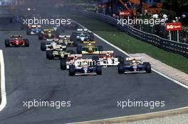 Riccardo Patrese (ITA) Williams FW14B Renault and team-mate Nigel Mansell (GBR) 1st position leads the group at start