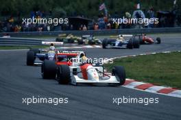 Ayrton Senna da Silva (BRA) McLaren MP4/7A Honda leads Nigel Mansell (GBR) Williams FW14B Renault 2nd position