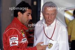Ivan Capelli (ITA) Ferrari talks with Sante Ghedini