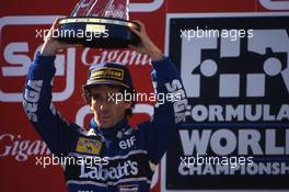 Alain Prost (FRA) Williams celebrates on podium  2nd position in the race and victory of the Drivers World Championship for the fourth time