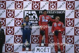 Alain Prost (FRA) Wlliams 2nd position Ayrton Senna da Silva (BRA) McLaren 1st position Mika Hakkinen (FIN) McLaren 3rd position celebrates on podium