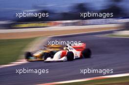 Michael Schumacher (GER) Benetton B193B Ford Cosworth battles with Ayrton Senna da Silva (BRA) McLaren MP4/8 Ford Cosworth 2nd position