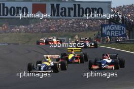 Alain Prost (FRA) Williams FW15C Renault leads a group
