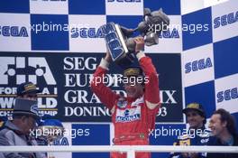 Ayrton Senna da Silva (BRA) McLaren 1st position celebrates on podium