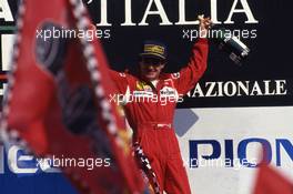 Jean Alesi (FRA) Ferrari celebrates 2nd position on podium