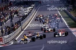 Alain Prost (FRA) Williams FW15C Renault 3rd position leads the group at start