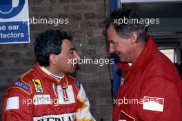 Michele Alboreto (ITA) Bms Scuderia Italia talks with Harvey Postlethwaite (GBR) Ferrari