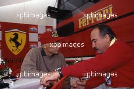 Niki Lauda (AUT) Ferrari talks with Clay Regazzoni (CH)