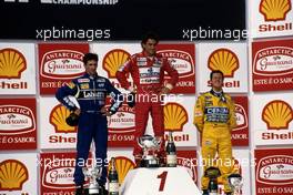 Damon Hill (GBR) Williams 2nd position Ayrton Senna da Silva (BRA) McLaren 1st position Michael Schumacher (GER) Benetton 3rd position celebrates on podium