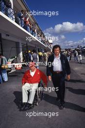 Clay Regazzoni (CH) walks with Giancarlo Minardi (ITA)