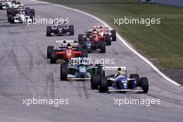 Ayrton Senna da Silva (BRA) Williams FW16 Renault leads Michael Schumacher (GER) Benetton B194 Ford Cosworth 1st position at start