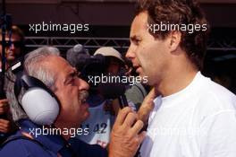 Gerhard Berger (AUT) Ferrari talks with journalist Ezio Zermiani during a interview