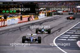 Ayrton Senna da Silva (BRA) Williams FW16 Renault leads Michael Schumacher (GER) Benetton B194 Ford Cosworth 1st position