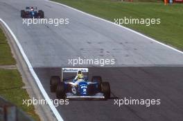Ayrton Senna da Silva (BRA) Williams FW19 Renault leads Roland Ratzemnerger (AUT) Simtex S941 Ford