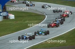 Ayrton Senna da Silva (BRA) Williams FW19 Renault leads Michael Schumacher (GER) Benetton Ford B194 and Gerard Berger (AUT) Ferrari 412T
