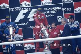 Michael Schumacher (GER) Ferrari 1st position celebrate podium with Jean Todt (FRA)